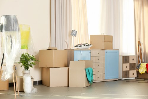 Moving team handling boxes in an elegant Knightsbridge apartment