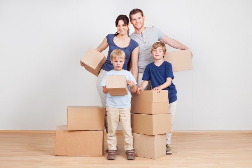 Local office moving crew handling desks and equipment in Knightsbridge