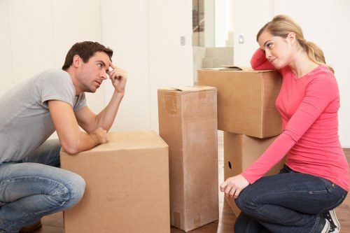 Professional movers preparing furniture and boxes for transport in Knightsbridge