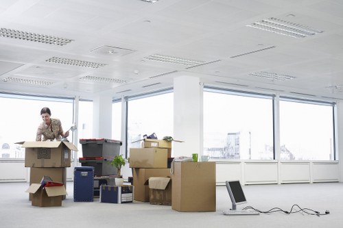 Packed boxes and furniture ready for transport by removal van in Knightsbridge
